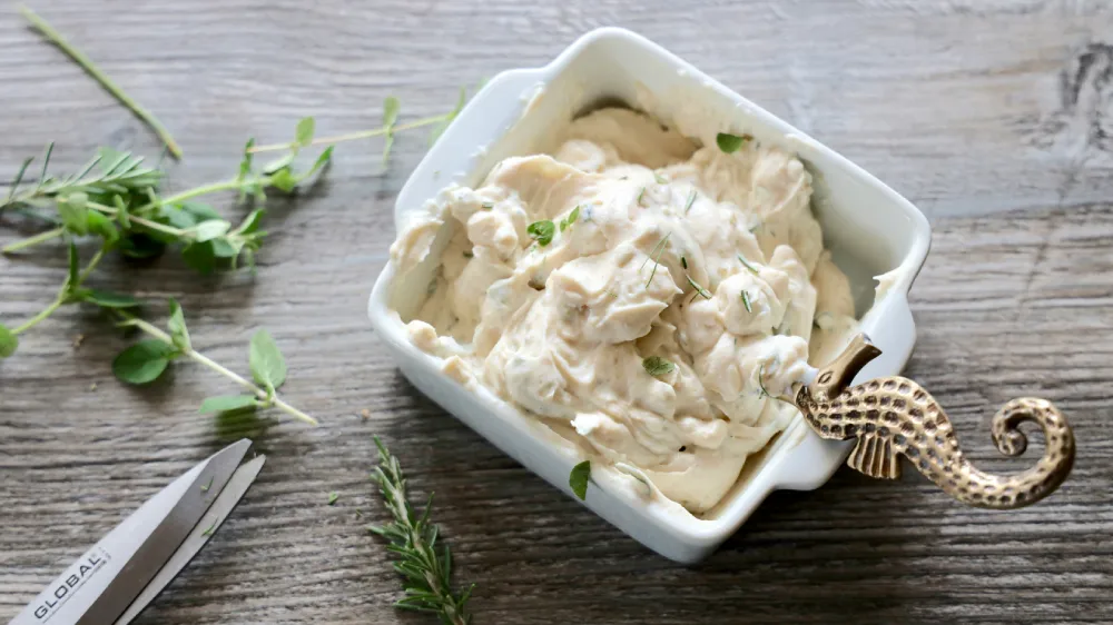 a bowl of cottage cheese with a spoon