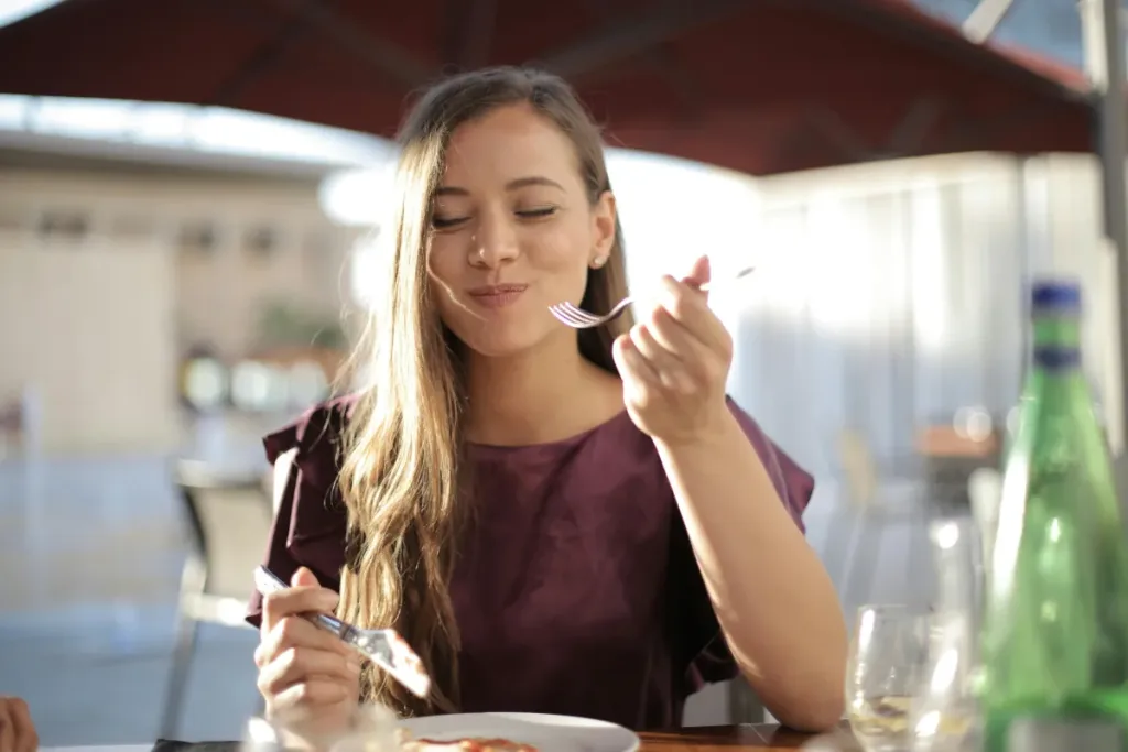 a woman eating when bored