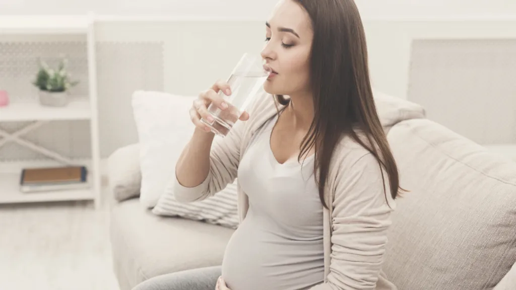 pregnant woman drinking water