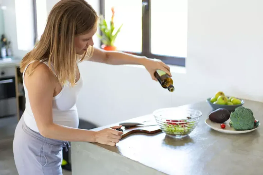 pregnant woman preparing food