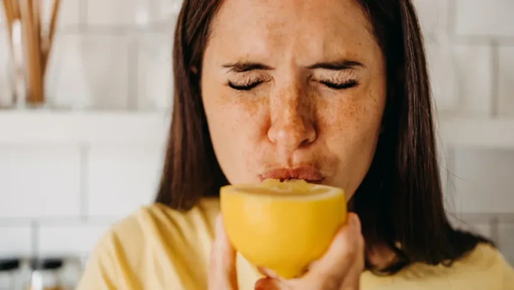 a woman eating lemon